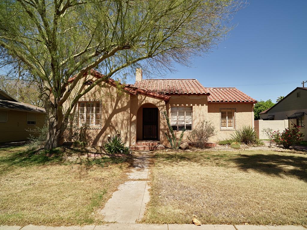 A Spanish Revival bungalow with a tile roof and arched entry in the Willo historic district, Phoenix